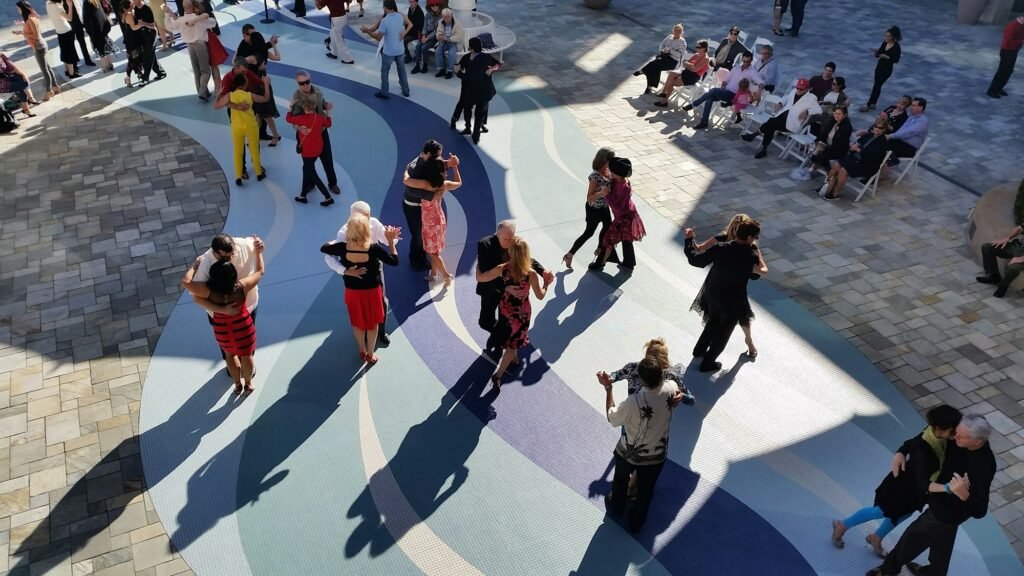 Group of people dancing tango at milonga event in Tampa, FL, USA