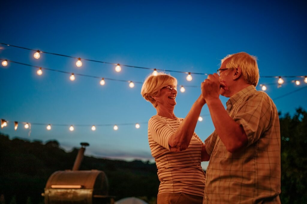 Senior couple laughing and having fun while dancing